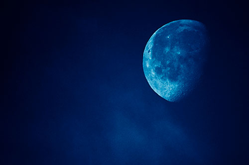 Moon Creeping Along Faint Cloud Mass (Blue Shade Photo)