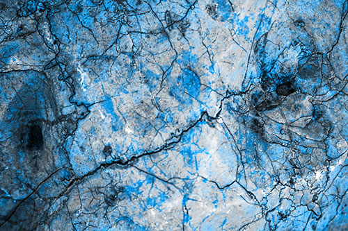 Smirking Chaos Cracked Rock Face (Blue Tone Photo)