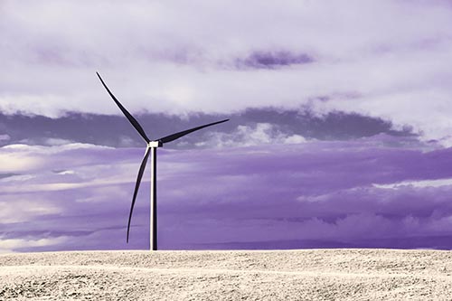 Lone Wind Turbine Standing Along Dry Prairie Horizon