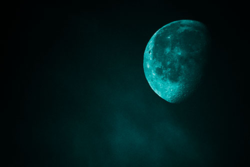 Moon Creeping Along Faint Cloud Mass (Cyan Tone Photo)