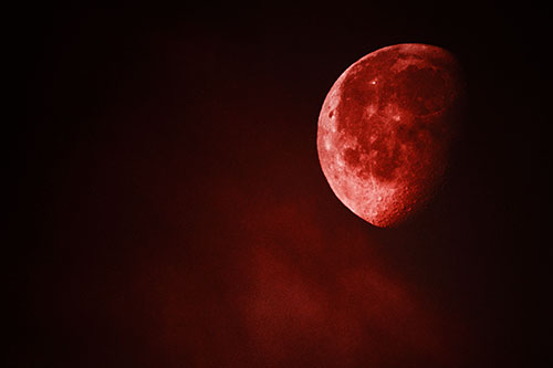 Moon Creeping Along Faint Cloud Mass (Red Tone Photo)