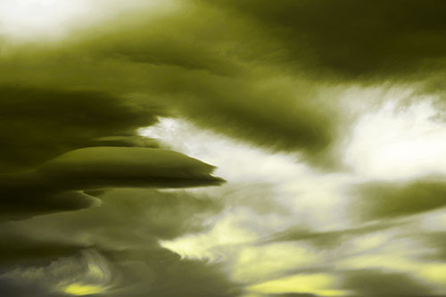 Smooth Cloud Sails Along Swirling Formations (Yellow Tone Photo)