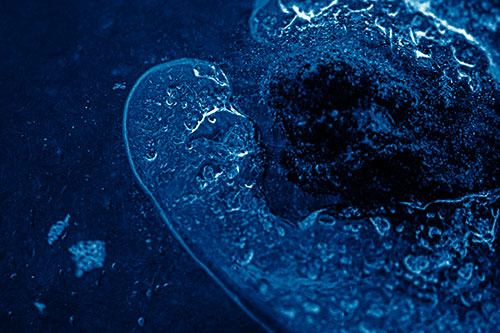 Angry Eyebrow Raised Ice Bubble Creature Bending Beside Mossy Rock (Blue Shade)