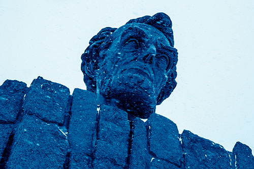 Blowing Snow Across Presidential Statue Head (Blue Shade Photo)