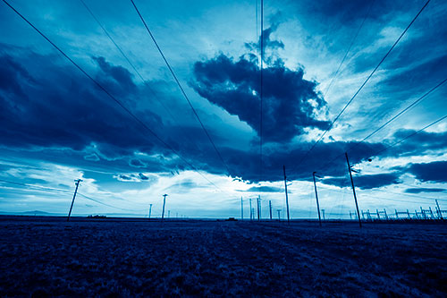 Creature Cloud Formation Above Powerlines (Blue Shade Photo)