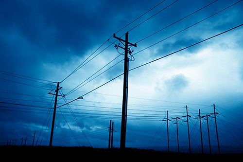 Crossing Powerlines Beneath Rainstorm (Blue Shade Photo)