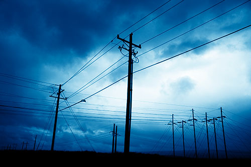 Crossing Powerlines Beneath Rainstorm (Blue Shade Photo)