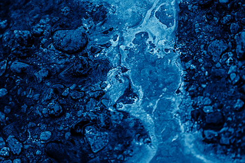 Distorted Oil Face Smearing Among Rocky Shore (Blue Shade)