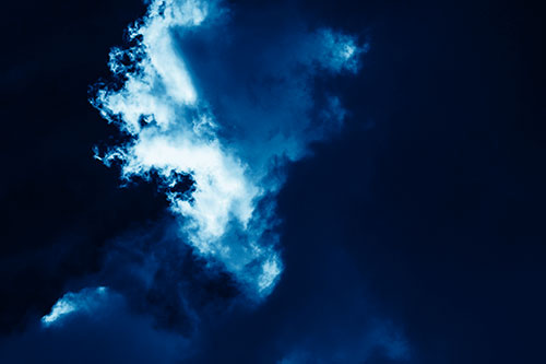Evil Cloud Face Snarls Among Sky (Blue Shade Photo)