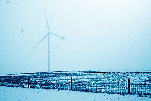 Fenced Wind Turbine Among Blowing Snow (Blue Shade Photo)