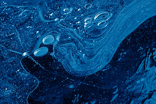 Frozen Bubble Clusters Among Twirling River Ice (Blue Shade Photo)