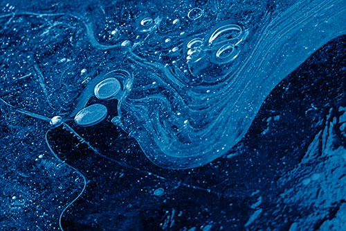 Frozen Bubble Clusters Among Twirling River Ice (Blue Shade)