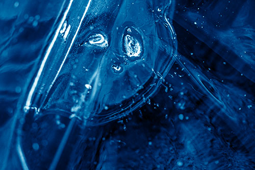 Frozen Unhappy Frowning Distorted River Ice Face (Blue Shade Photo)