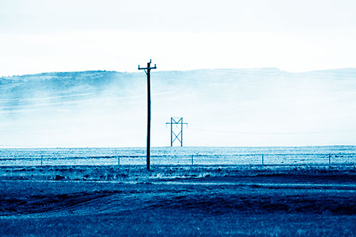 Heavy Fog Hiding Mountain Range Behind Powerlines (Blue Shade Photo)