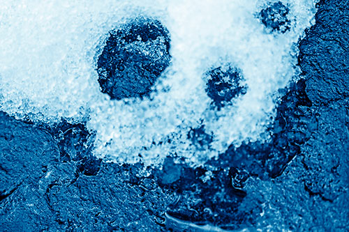 Ice Skull Snow Face Melting Atop Rock (Blue Shade Photo)