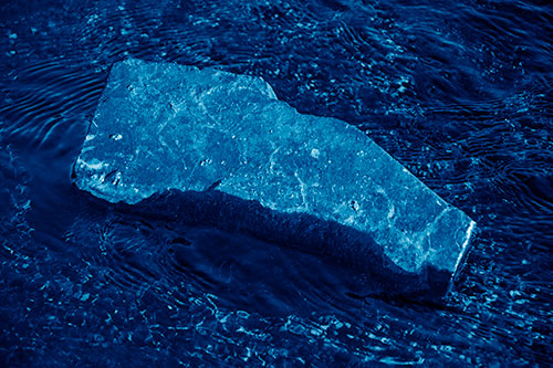 Massive Rock Atop Riverbed (Blue Shade Photo)