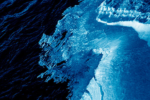 Melting Ice Face Creature Atop River Water (Blue Shade)