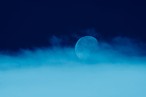 Moon Rolling Along Clouds (Blue Shade Photo)