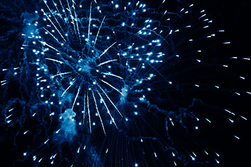 Multiple Firework Explosions Send Light Orbs Flying (Blue Shade Photo)