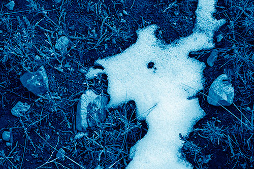 Peering Humanoid Snow Face Creature Among Rocks (Blue Shade Photo)