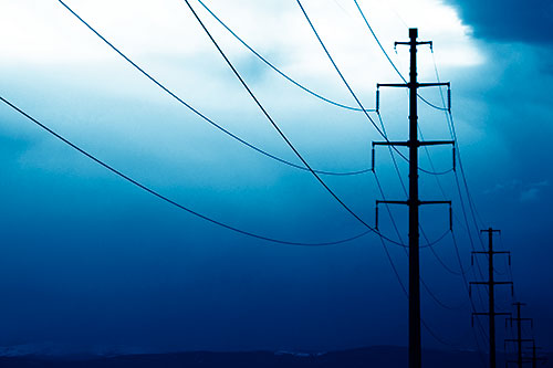 Powerlines Receding Into Thunderstorm (Blue Shade Photo)
