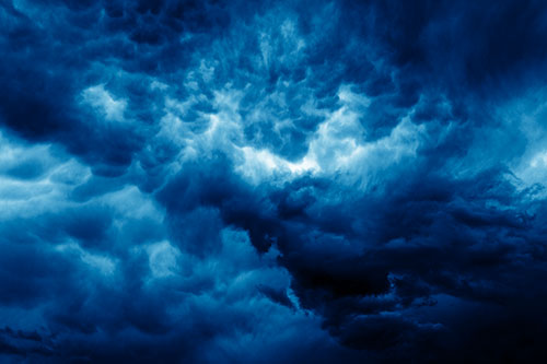 Raging Thunderstorm Clouds Brewing Among Sky (Blue Shade)