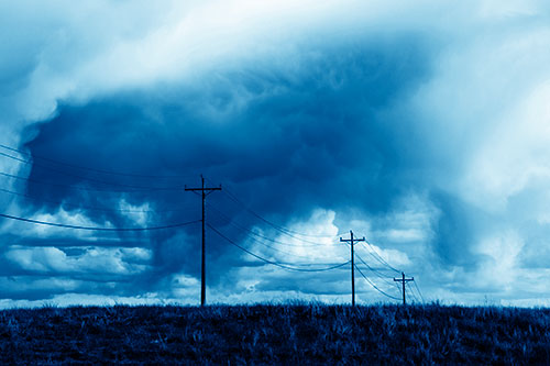 Rainstorm Clouds Twirl Beyond Powerlines (Blue Shade)