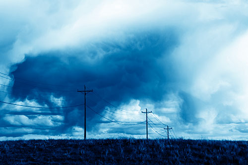 Rainstorm Clouds Twirl Beyond Powerlines (Blue Shade Photo)