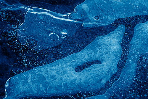 Scared River Ice Face Separating Among Frigid Water (Blue Shade)