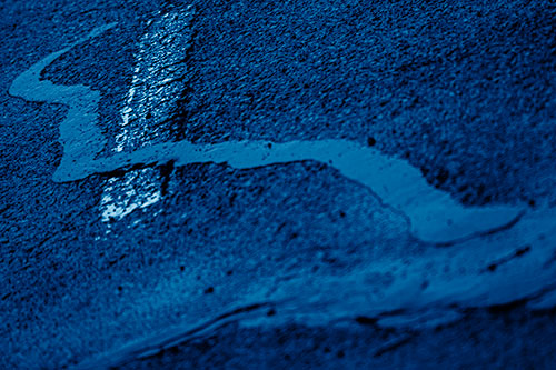 Slithering Tar Creeps Over Pavement Marking (Blue Shade Photo)
