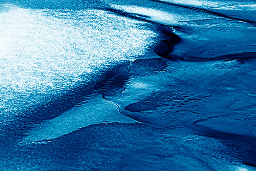Sloping Ice Melting Atop River Water (Blue Shade Photo)