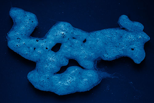 Sorrow Morphing Bubble Face Floating Above Soil (Blue Shade)