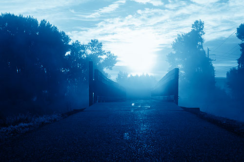 Sun Rises Beyond Foggy Wooden Walkway Bridge (Blue Shade Photo)