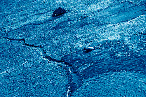 Three Ice Melting Puddles (Blue Shade Photo)