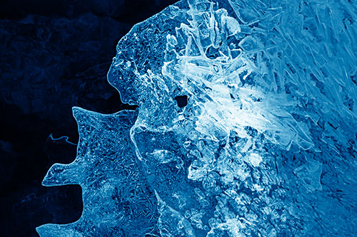Two Faced Optical Illusion Ice Face Hanging Above River (Blue Shade)