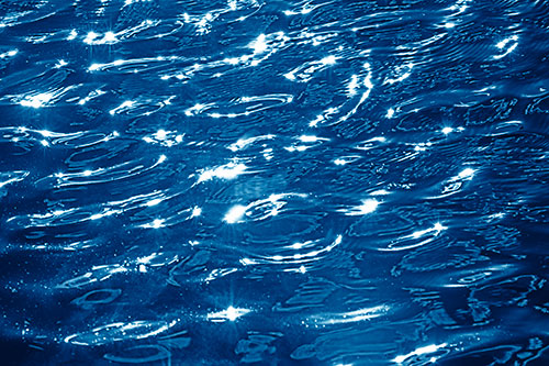 Water Ripples Sparkling Among Sunlight (Blue Shade Photo)