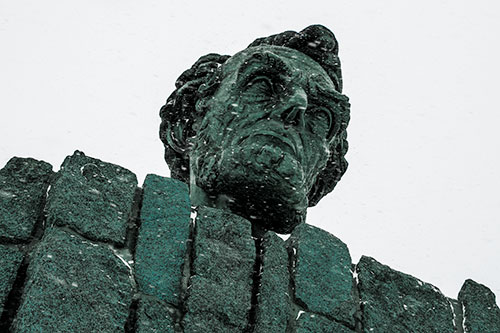 Blowing Snow Across Presidential Statue Head (Blue Tint Photo)