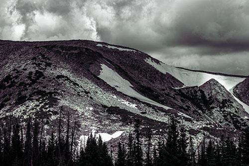 Clouds Cover Melted Snowy Mountain Range (Blue Tint Photo)