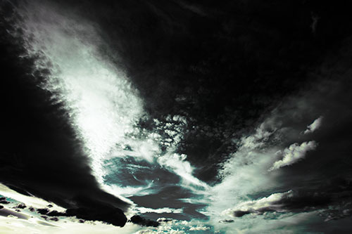 Curving Black Charred Sunset Clouds (Blue Tint Photo)