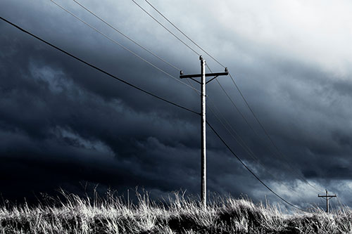 Dark Thunderstorm Clouds Over Powerline (Blue Tint Photo)