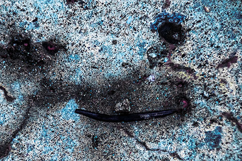 Evil Eyed Concrete Face Evaporating (Blue Tint Photo)