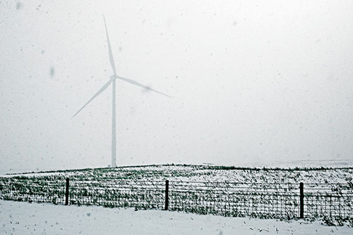 Fenced Wind Turbine Among Blowing Snow (Blue Tint)