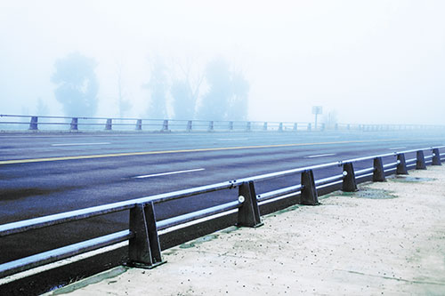 Fog Surrounds Deserted Sidewalk Roadway (Blue Tint Photo)
