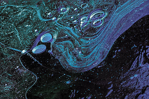 Frozen Bubble Clusters Among Twirling River Ice (Blue Tint)