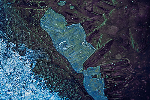 Frozen Bubble Eyed Ice Face Figure Along River Shoreline (Blue Tint Photo)