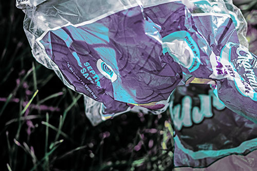 Growling Plastic Charmin Bag Among Grass (Blue Tint)
