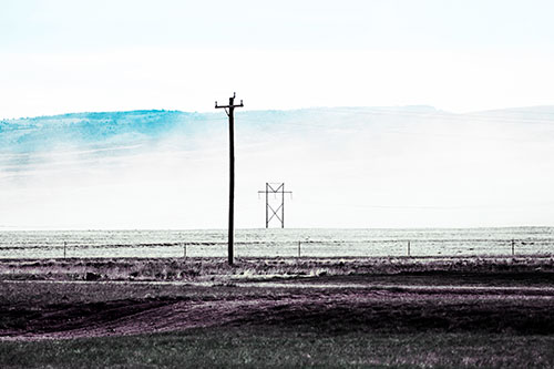 Heavy Fog Hiding Mountain Range Behind Powerlines (Blue Tint Photo)