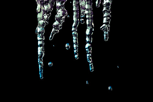Jagged Melting Icicles Dripping Water (Blue Tint Photo)