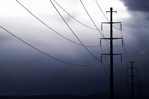Powerlines Receding Into Thunderstorm (Blue Tint Photo)