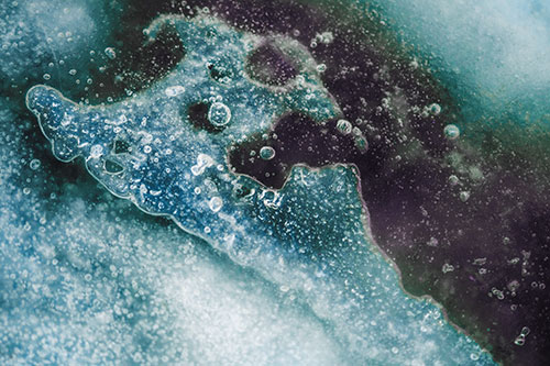 Screaming Submerged Bubble Face Creature Among Icy River (Blue Tint)